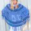 Pineapple Poncho Crochet Pattern – Blue version on Model looking down with hands on hips 2 Pineapple Poncho Crochet Pattern - Blue version on Model looking down with hands on hips 2