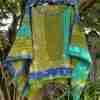 Sharon’s Raindrops Poncho – hanging in a tree Sharon's Raindrops Poncho - hanging in a tree