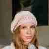 Charlston Beanie Crochet Pattern - light and lacy woman's hat - top tilted to the side - on thoughtful model from side