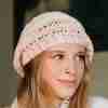 Charlston Beret Crochet Pattern - light and lacy woman's hat - up close on model from side