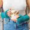 Trellis Mitts - On model holding mug of hot chocolate between her two hands