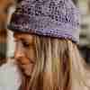 Rapt-Hearts-Beanie-Crochet-Patterns---in-mauve---on-Model-indoors