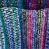 Ocean Layers Wrap Crochet Pattern by ReVeDesignCo - hanging outside with light shining through showing the details - Multicolored Sock Yarn version