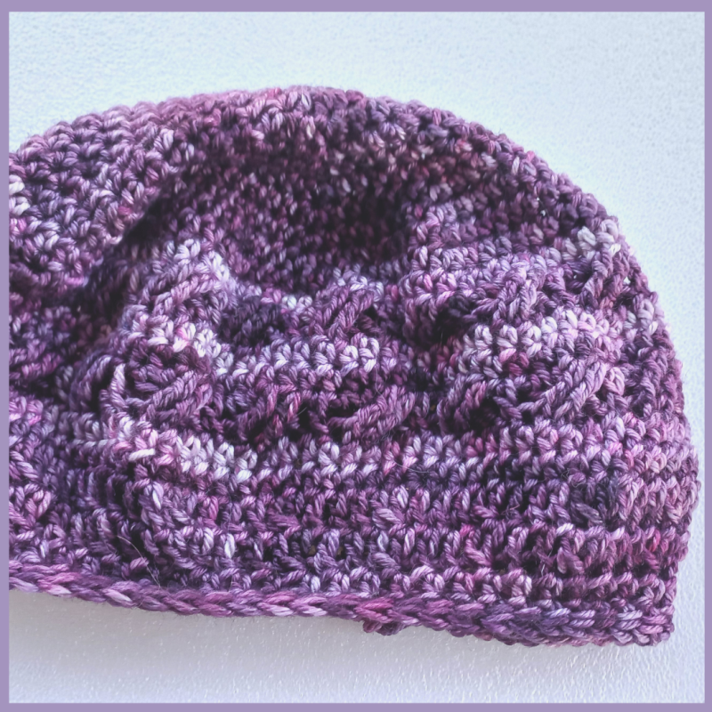 Brindy Beret – Flat lay in purples – side view Brindy Beret - Flat lay in purples - side view
