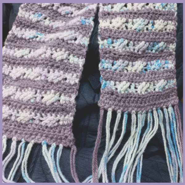 Framed photo of Brindie Scarf in 2-tone Mauve & Creamy blue - close-up of ends and fringe
